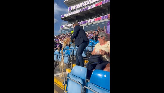 Man spills beer at Headingley Stadium, Leeds