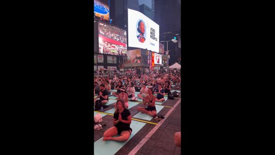 Yoga event and World Cup fans create unusual scene in Times Square in New York, USA