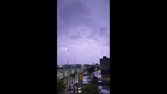 Lightning illuminates purple sky over Barcelona during severe storm in Spain