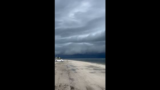 Dark cloud formation looms over beach in Safety Harbor, Florida, USA