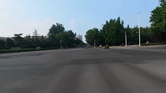 Car loses control and crashes into pole at intersection in Shandong, China