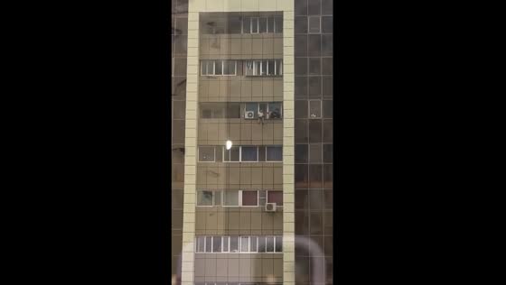 Risky ledge stroll: Astana teens defy heights on 13th floor