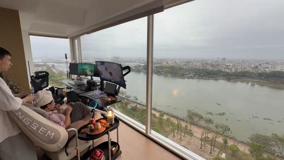 Couple relaxes with cozy gaming setup at home in Guangdong, China