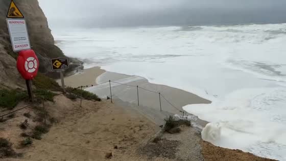 High king tide waves hit the shores of Half Moon Bay, California, USA