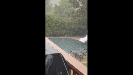 Penny-size hail accumulates during heavy rain in Hot Springs, USA