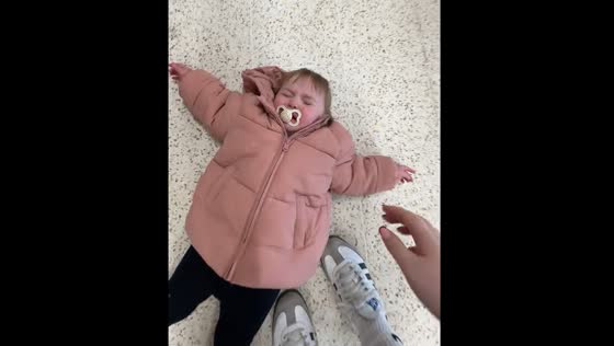 Toddler lies on store floor crying in Mountain Ash, UK