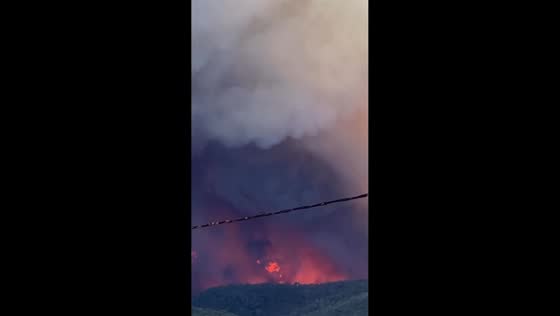 Massive wildfire sends thick smoke over Natural Park of Les Gavarres in Girona, Catalonia, Spain