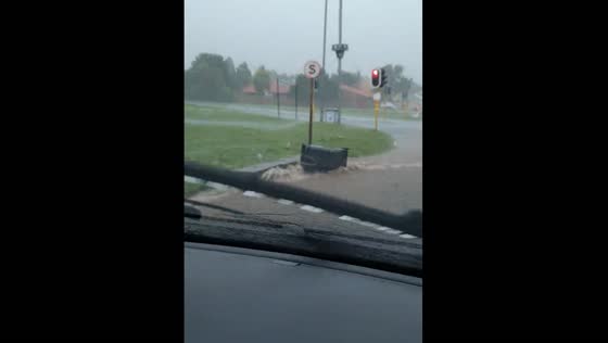 Garbage bins were swept away by floods caused by a hailstorm in South Africa.