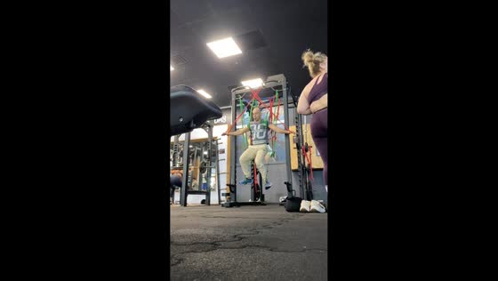 Man performs suspended resistance band exercise in Ashkelon, Israel