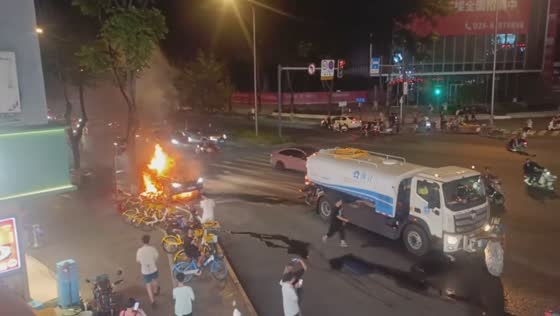 Fire trucks arrive to extinguish burning vehicle in Sichuan, China