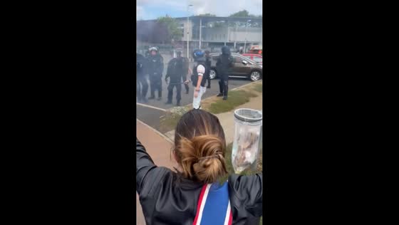 Julie Garnier intervenes as students and police confront each other in Moissy-Cramayel, France