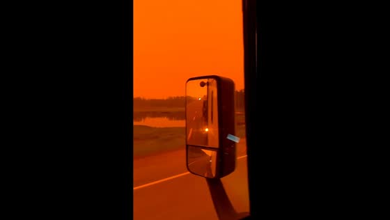 Wildfire smoke creates eerie orange sky in Greenstone, Canada
