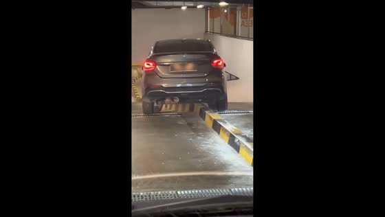Car stuck on parking curb causes traffic at Icon Residenz in Petaling Jaya, Malaysia