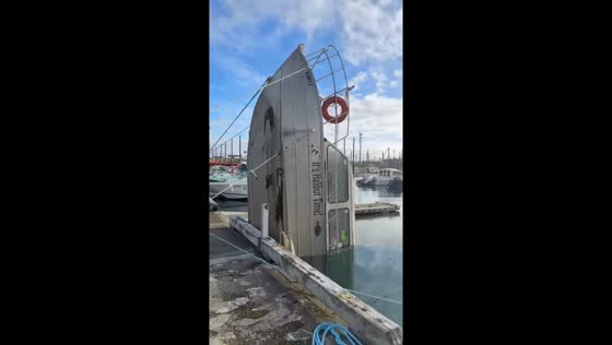 Partially submerged fishing boat spotted in Homer, Alaska, USA