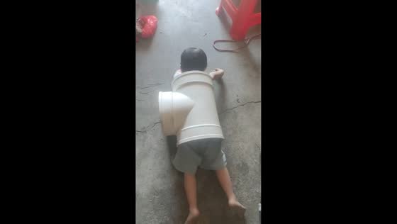 Playful boy gets stuck inside a huge pipe in Guangdong, China
