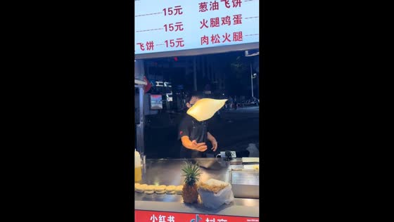 Street food vendor slips while making “flying cake” in Guangxi, China