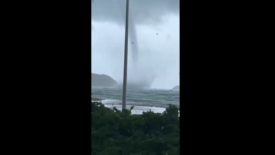 Dual waterspouts descend: Santinho, Brazil