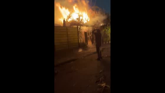 Fire engulfs house and car in Macul, Santiago Metropolitan Region, Chile