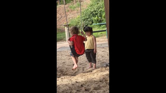 Child patiently waits for swing in Brisbane, Australia
