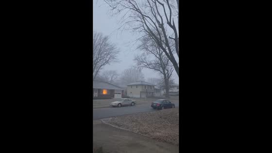 Snow squall reduces visibility during evening in Independence, Missouri, USA