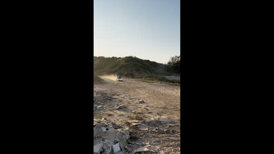 Go-kart rider kicks up trail of dust along dirt road in Shandong, China