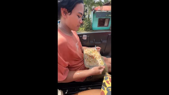 Boy gets food splashed by wind while riding pickup in Misamis Occidental, Philippines