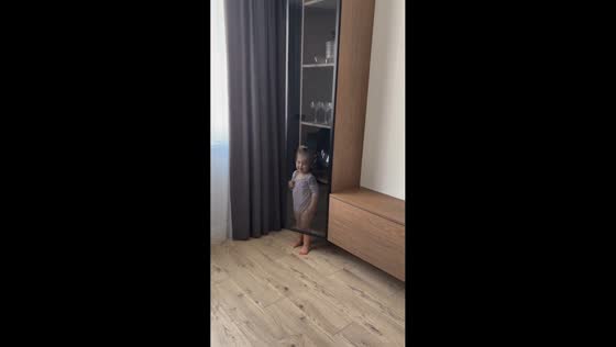 Little girl adorably hides in plain sight in Minsk, Belarus
