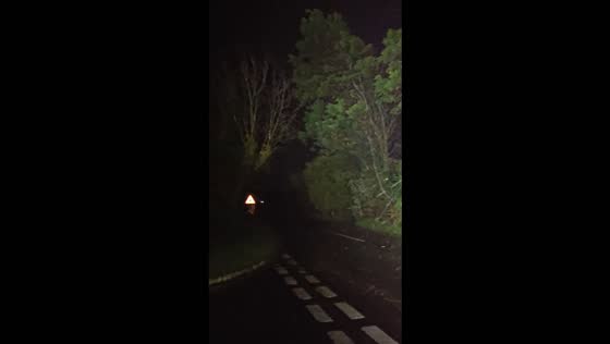 Storm Austen unleashes heavy rain and fierce winds along a rural road in Cornwall, UK
