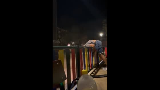 Person jumps and bounces off metal fence in Madrid, Spain