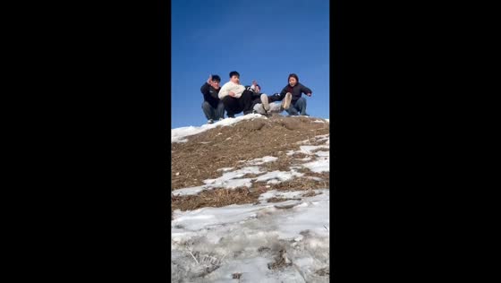 Group of people tumble down hilltop in Heilongjiang, China