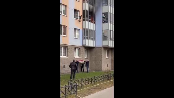 Young boy jumped and rescued from a burning apartment in St. Petersburg, Russia