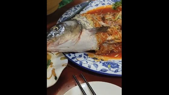 Fish moves on plate after being eaten in Jiangsu Province, China