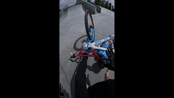 Bike mishap: fakie trick gone wrong at skate park