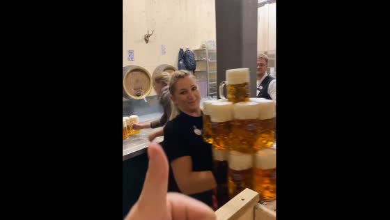 Waitress impresses with beer-serving skills at Munich Oktoberfest, Germany