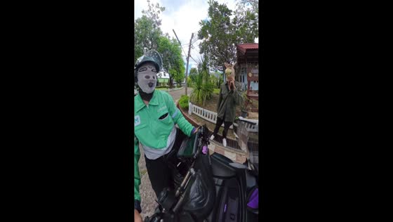 Playful horse mask ride on motorcycle in Thailand