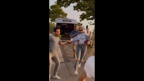 Minibus startles crowd during roadside photoshoot in Phuket, Thailand