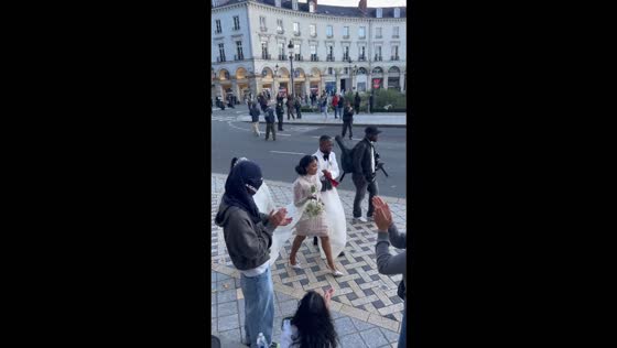 Bride and groom cheered by protesters on their way to city hall in Tours, France