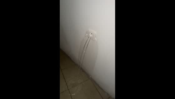 Floodwater pours from electrical outlet during severe storm in Vauvert, France