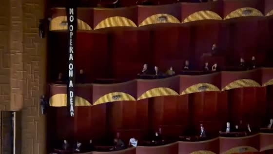 Climate activists ejected: opera house clash over 'no opera on a dead planet' banner