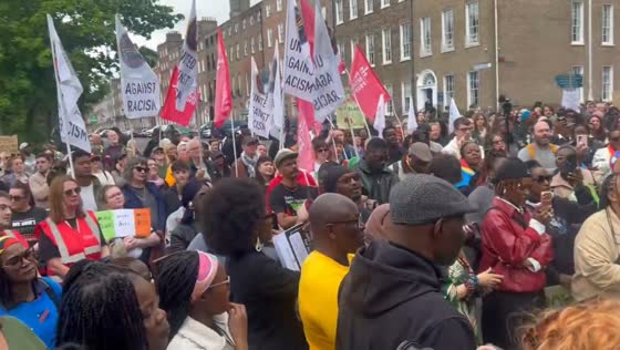 Crowds gather outside Irish Parliament demanding justice for Yves Sakila in Dublin, Ireland