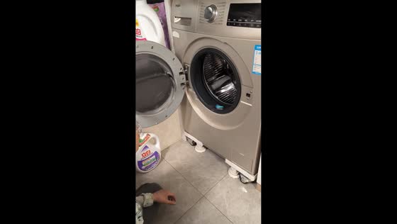 Boy spins toy car in washing machine in Gansu, China