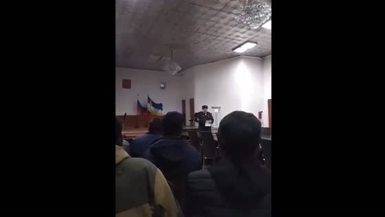 The representative of the local military registration and enlistment office speaks to the mobilized in Buryatia