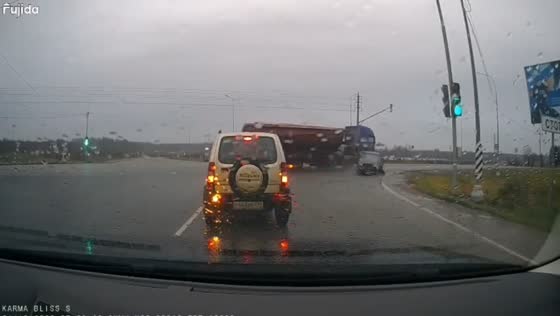 Truck and car collide during rainy morning traffic in Podolsk, Russia