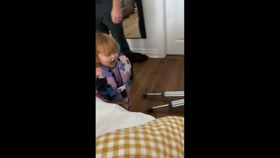 Toddler proudly wears life vest over church clothes in London, UK