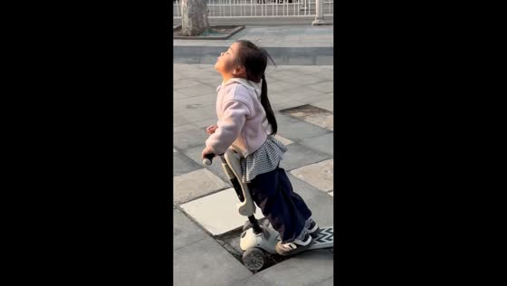 Girl tumbles from scooter after hitting broken sidewalk in Tianjin, China