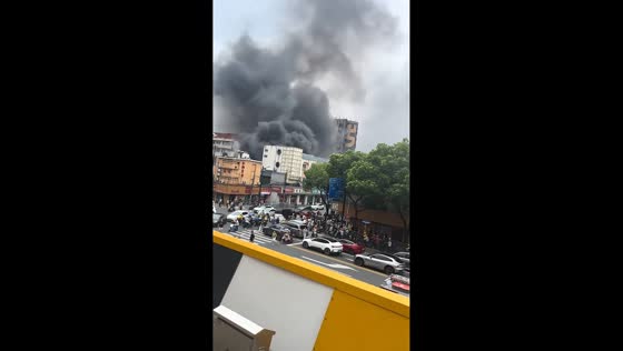 Storefront fire sends thick smoke over street in Shanghai, China