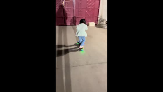 Girl on scooter bumps into closed gate in Tianjin, China