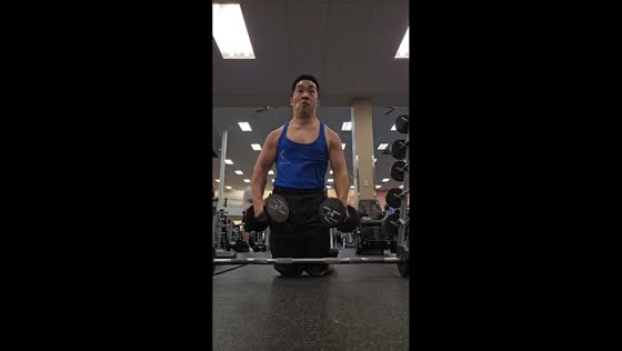 Man with cerebral palsy completes shoulder workout in Newport, Virginia, USA