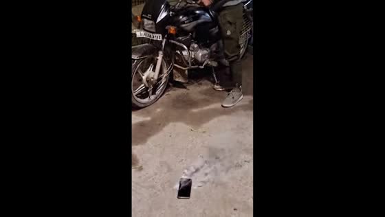 Man's phone emits smoke in his pocket in Delhi, India