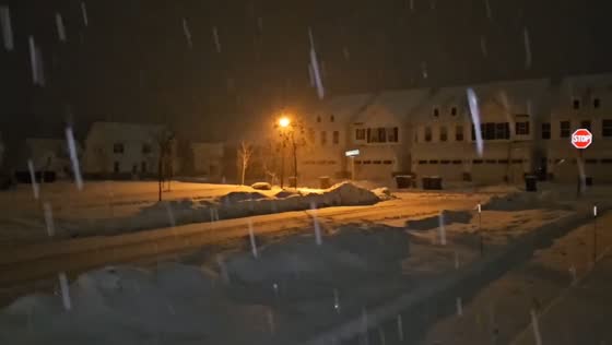 Deep morning snowfall blankets neighborhood in Aurora, Ohio, USA